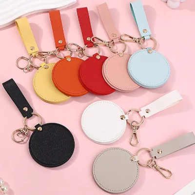 Round Portable Cosmetic Mirror PU Leather Rotating Makeup Mirror with Small Pendant Keychain