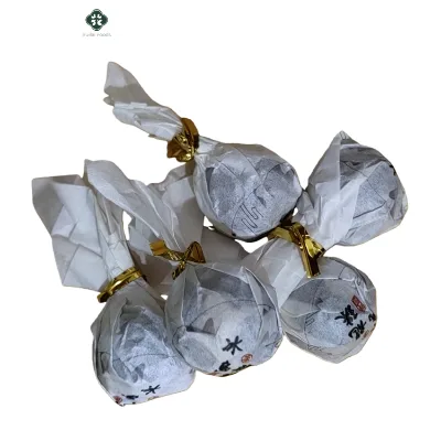 China Hot Selling Rock Sugar Sweet Flavor Dragon Sheng Puer Ball Tea