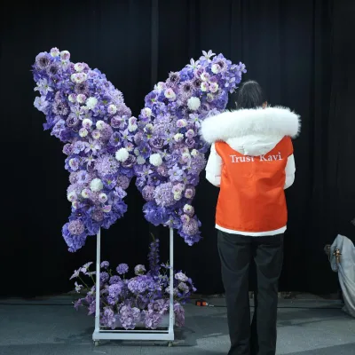Kavi New Design for a Purple-themed Party Event Features a purple Artificial Rose Archway and a butterfly Backdrop.