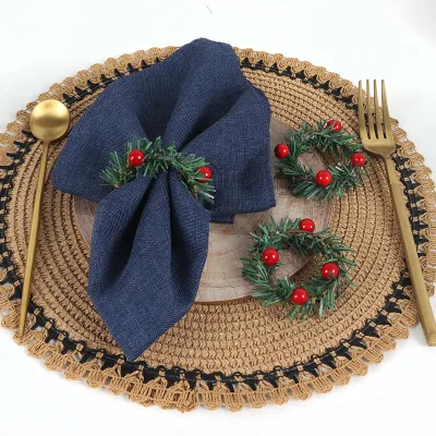Holiday Table Decorations: Christmas Napkin Rings, Pine Needles, and Checkered Bows.