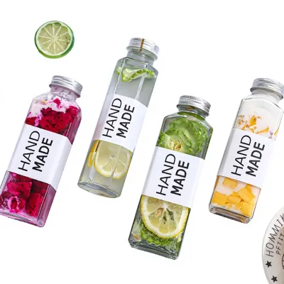 Wholesale Empty Summer Cold Drinks Transparent Customize Glass Bottle Juice Beverage Glass Bottles with Aluminum Lids
