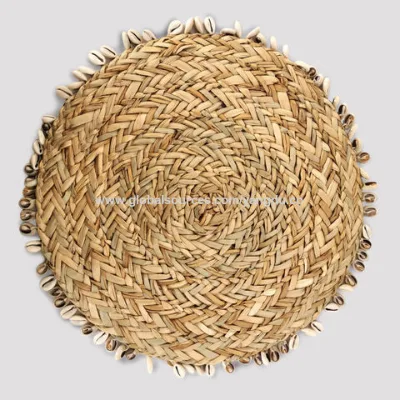 Eco-friendly straw woven table placemats with shell decor.
