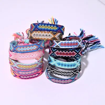 Hot Sale Boho Style Nepal Hand Braided Lucky Friendship Wristband Chain & Link Bracelet with Tassel