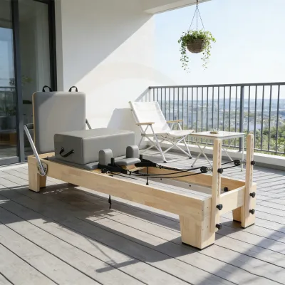 Solid wooden Portable Pilates Reformer Machine Smooth Stainless Rail Adjustable Spring System Body Balanced Design for Studio