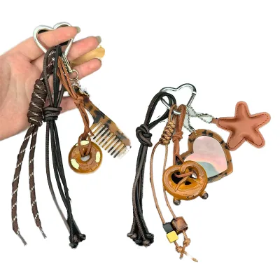 2026 Miu Series Light Keychain Circular Mirror Cartoon Waterproof Fashionable Cross-Border Woven Rope Bag Pendant Personalized
