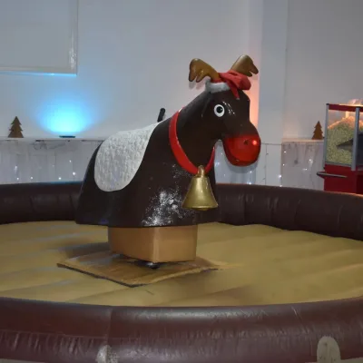 Commercial Christmas Mechanical Rodeo Reindeer Sports Game Challenge Mechanical Bull Riding Machine Inflatable Crazy Cowboy