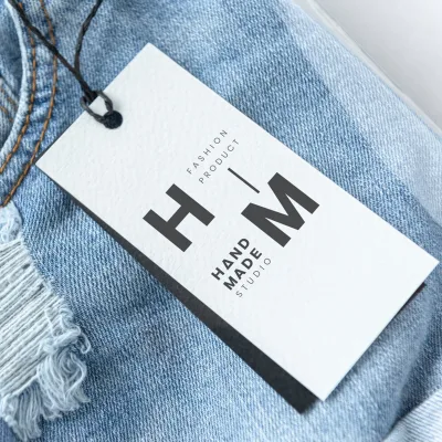 Hang Tag With Logo Design and Printing Fashion Garment Paper Hang Tag Embossed Clothing Swing Tag With String