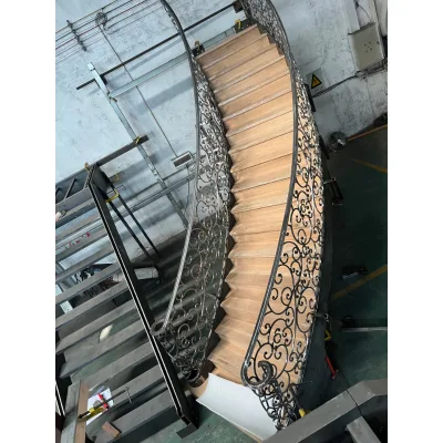 Customized Indoor Carbon Steel U-Channel Stringer LED Light Wooden Treads Wrought Iron Railing Curved Arc Helical Stairs