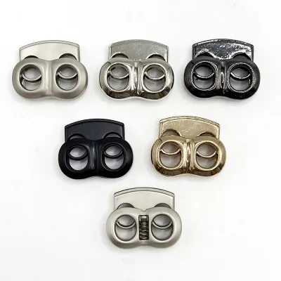 Adjustable Dual-Hole Sportswear Stopper with Oval Pattern Metal Pig Nose Elbow Slider Spring Cord Button Alloy Material