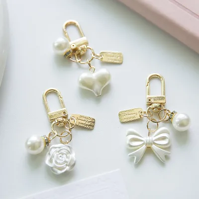 New Creative New Pearl Alloy Key Chain Pendant Fresh Bow Heart Design with Earphone Set Small Accessory Metal Material