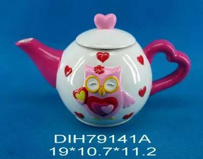 Hand-painted ceramic kettle with heart shaped handle