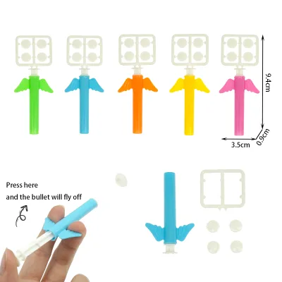 Wholesale Kids Mini Angel Wings Plastic Bullet Push Shooter Toys Mini Pellet Eject Launcher Kids Vending Machine Capsule Toys