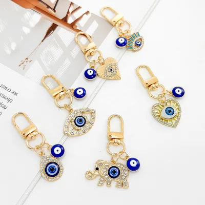 2025 Creative Rhinestone Blue Eye Metal Keychain Evil Eyes Earphone Case Pendant Bag Purse Charm Lucky Blue Evil Eye Keychain