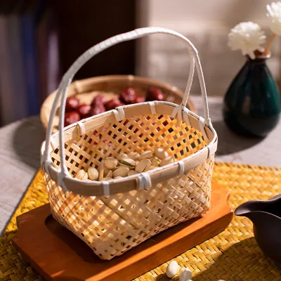 Traditional Bamboo A small bamboo-woven basket with a round handle for tea, snacks and fruits