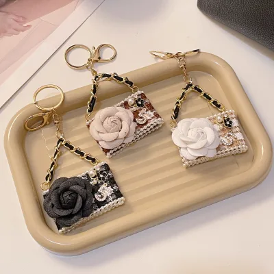 Elegant Luxury Mini Imitation Handbag Keychain Camellia Flower Decor Pearl Trim Woven Texture Bag Charm Fashion INS Style