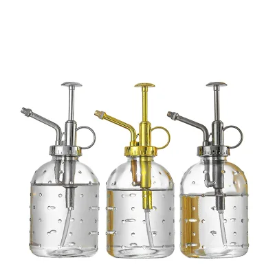 A clear Watering Glass Can Has a Golden Copper Nozzle Pumpkin Shape Watering Gardening Tools