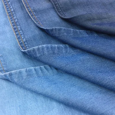 Good Quality Factory Directly 100% Tencel 5.8/5.4oz Denim Jeans Fabric for Trousers Dress in Stock