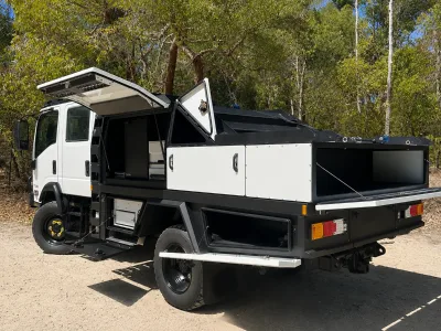 4x4 Adventure Truck Camper with Roof Boat Rack Toy Hauler System and Off Road Living Space
