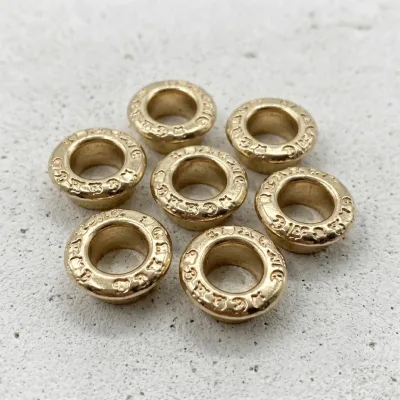 Premium Round Metal Eyelet Custom Font Embossed Garment Grommets Oeillets Metalliques for Luxury Hoodie Jacket Sourcing
