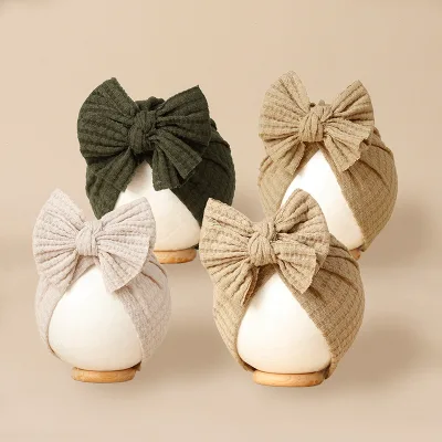 2026 Baby Hat Pure Color Wholesale Baby Kids Sweet Salmon Turban Elastic Waffle Butterfly Fetal Cap Newborn Soft Caps