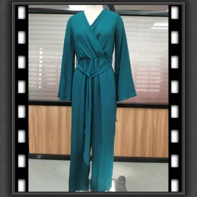 OEM woman's polyester jumpsuit with front across deep v-neck and waist self fabric strap