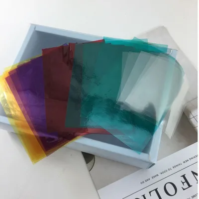 Wholesale Color Clear OPP Film Transparent Cellophane Wrap for Chocolate Candy Cookies Food Grade Plastic Cellophane Wrap Sheet