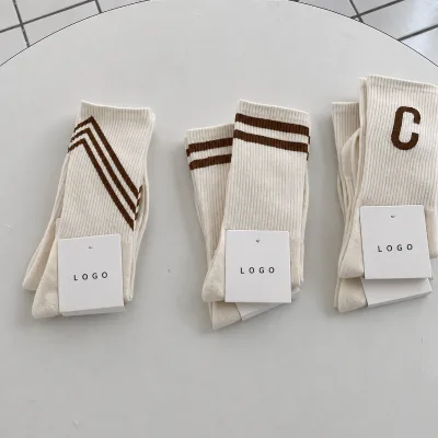OEM Factory Custom Ribbed Knit Cream Jacquard Crew Socks Unisex Studio Boutique SportsSocks