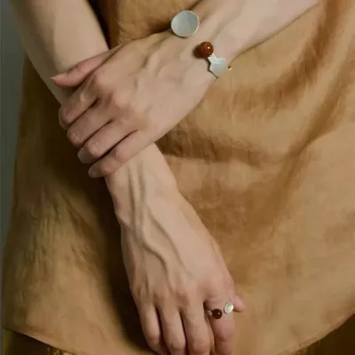 Tanned Open-style Bracelet Set with a Sophisticated, Minimalist Aesthetic