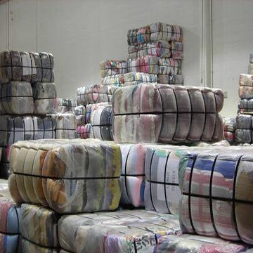 We Sell Clothes at Low Prices. Stock Clothing Inventory. a Variety of Colors and Styles. Male, Female, Child, Thin, Thick