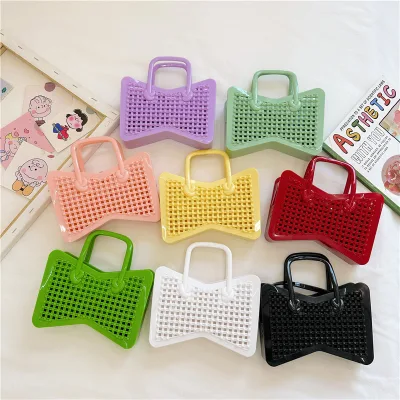 Kids Hollow Out Mini Handheld Jelly Bag Bow Shaped Candy Color Crossbody Bag New Fashion Handbag with Chain Women Girls Bag