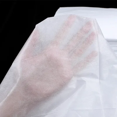White Nonwoven Perforated Beauty Massage Spa Point Break Medical Disposable Bed Sheet Roll
