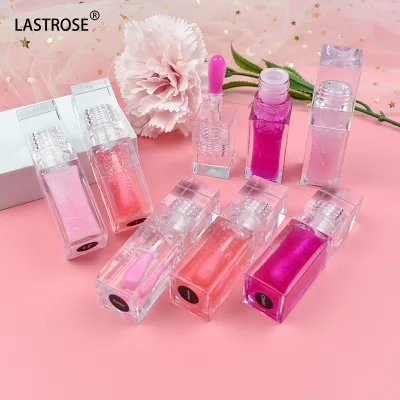 Hot Sale Vegan Strawberry Watermelon Fruit Plumping Lip Oil Transparent Magic Color Changing Lip Oil Shimmer