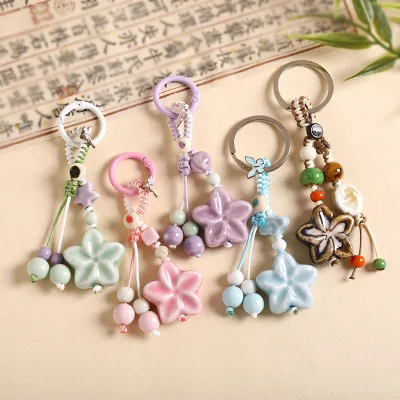 Wholesale Fresh and Whimsical Ceramic Flower Braided Key Rings Stylish Artistic and Cute Ceramic Flower Key Rings and Bag Charms