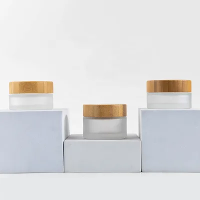 Wholesale Multi-purpose Container 10g 20g 30g 1oz Cosmetic Cream and Moisturizer Jar Custom Frosted Glass Jar with Wooden Lid