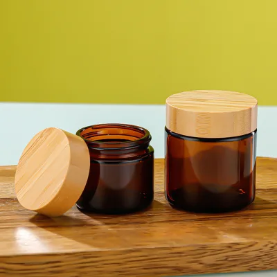 Cosmetic glass jar 100 150 200 g stock amber glass jar amber glass jars with bamboo lids
