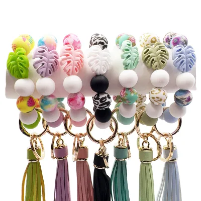 2026 Wholesale Luxury Women's Lobster Clasp Silicone Wristlet Keychain Custom Bead Leaf Flower Bracelet Woven Tassel Included