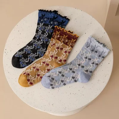 Wholesales Women's Retro Embossed Floral Jacquard Mid-calf Socks with Ruffled Lace Cuffs Textured Soft Knit Socks