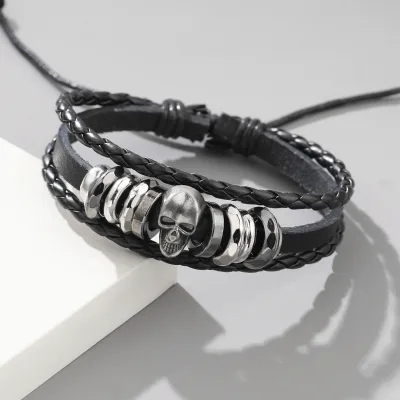 Cross-border hot-selling personalized retro bracelet with metal punk skull design men's cowhide bracelet woven leather bangle