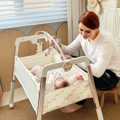 Wholesale Easy-clean Adjustable Height Space-saving 2-in-1 Nursery Changing Table Crib with Hanging Toys
