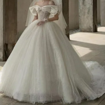 2023 Customize Bow Tie Shoulder Wedding Dresses Ball Gown Off Shoulder Applique Lace Dresses Simple Temperament Ball Gown