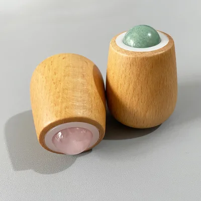 Facial Massage Tool Including a Roller and Hand Massager Designed for Skincare and Eye Featuring a Wooden Handle Jade Material