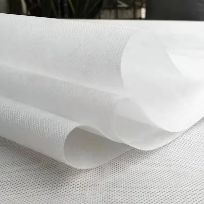 100% Polyester Nonwoven Fabric Lightweight 60GSM UV-Anti Dot Style for Hospital Protective Surgical Gown Made in China