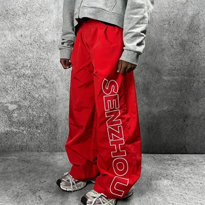 High Quality Custom Embroidery logo Loose Waterproof Windbreak Polyester Trousers Baggy Nylon Track Pants for Men