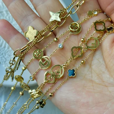 Stainless Steel Gold Women's Trendy Four Leaf Clover Dot Ball Shape Bangle with Chain Link Design