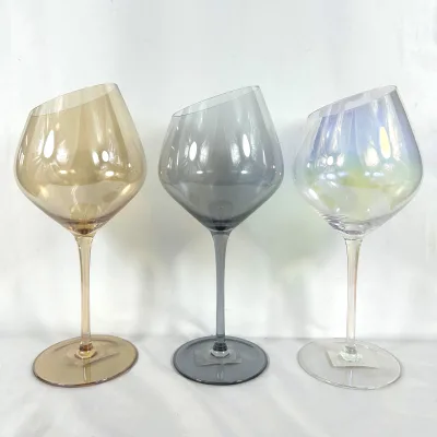 Striking set of three wine glasses feature modern angled bowl design and a unique color finish