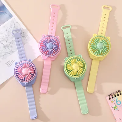 2025 Celebrity Style Mini Pocket Cartoon Plastic Dry Battery Fan for Children Portable Outdoor Watch Fan