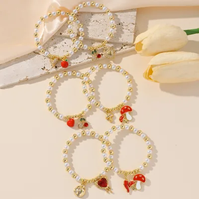 Adorable Gold and Pearl Strung Bracelets with Cute Pendent for Casual OutingsFLBBG72