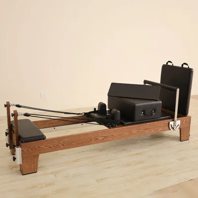 Walnut Wood Color Pilates Reformer Silent Track Customizable Leather Color Factory Direct Supply for Commercial Studio