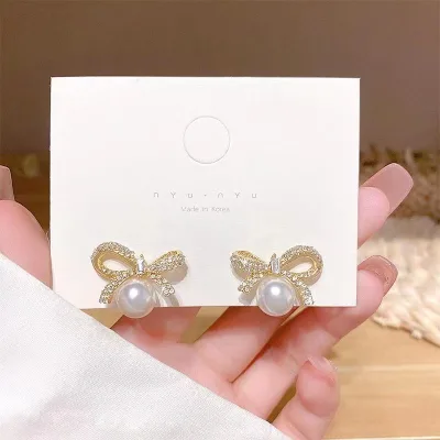 Stylish bow earrings, new French rhinestone pearl stud , versatile and popular